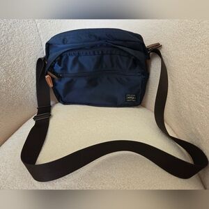 Blue and Brown Messenger Bag with Adjustable Strap and Durable Material